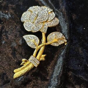 Elegant Gold and Silver Floral Brooch Marked Nolan Miller.
